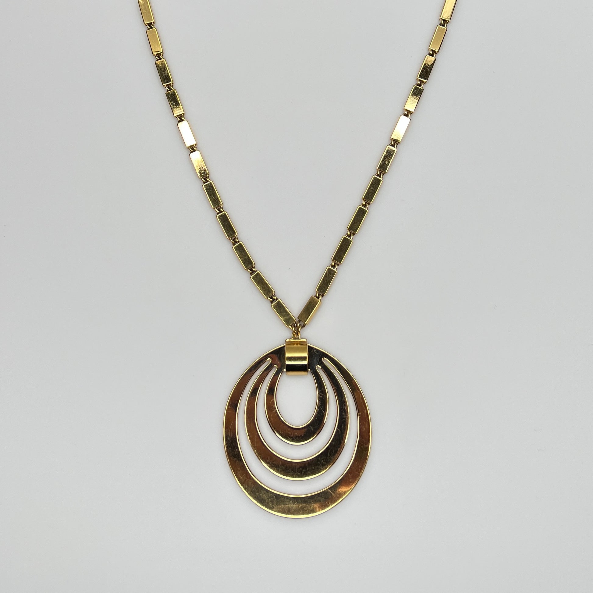 1980s Monet signed goldtone necklace with geometric pendant and rectangular chain
