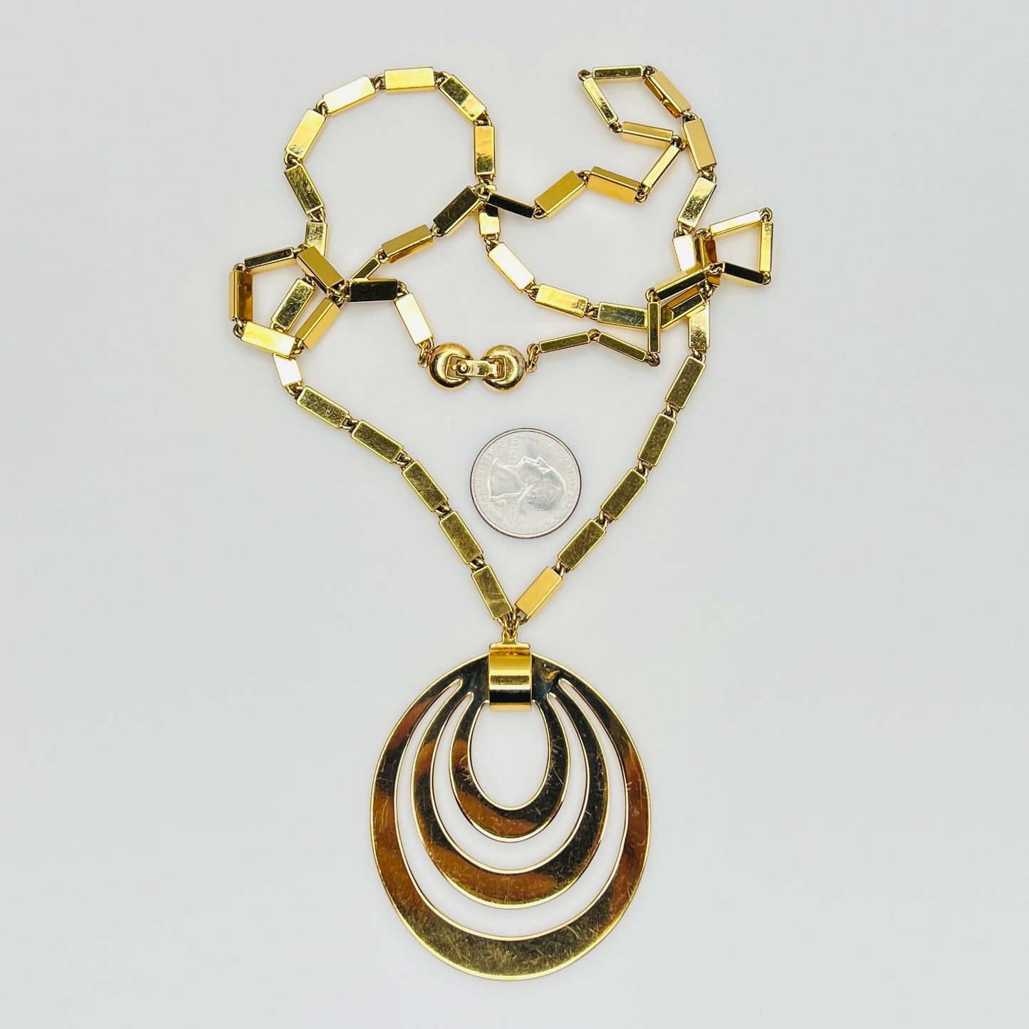 1980s Monet signed goldtone necklace with geometric pendant and rectangular chain