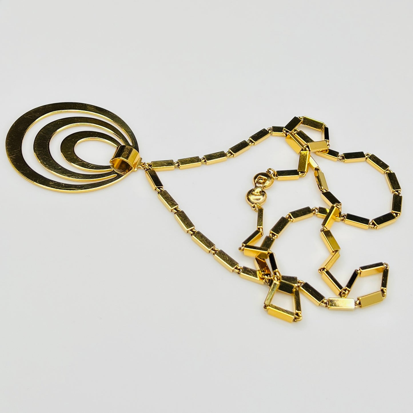 1980s Monet signed goldtone necklace with geometric pendant and rectangular chain