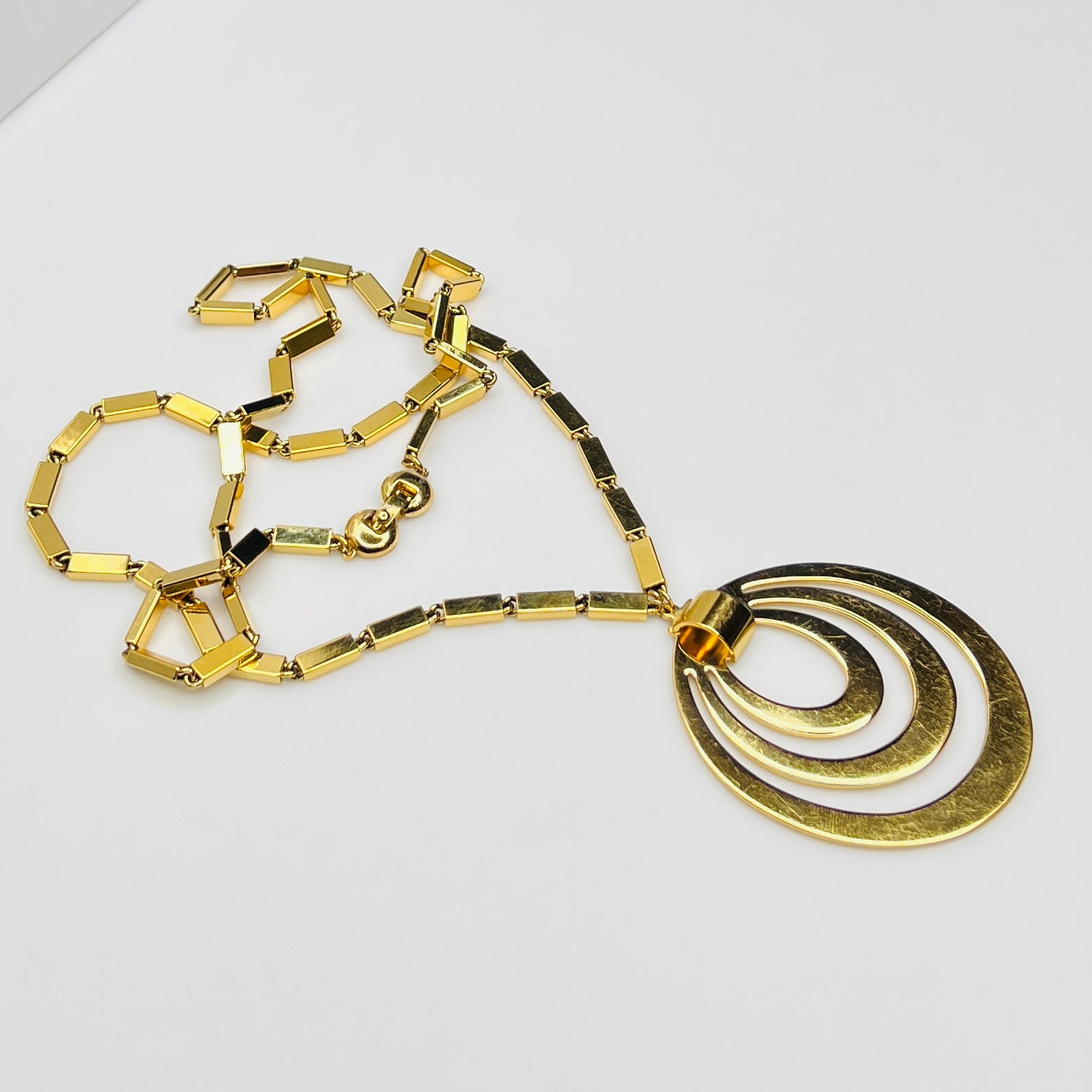1980s Monet signed goldtone necklace with geometric pendant and rectangular chain