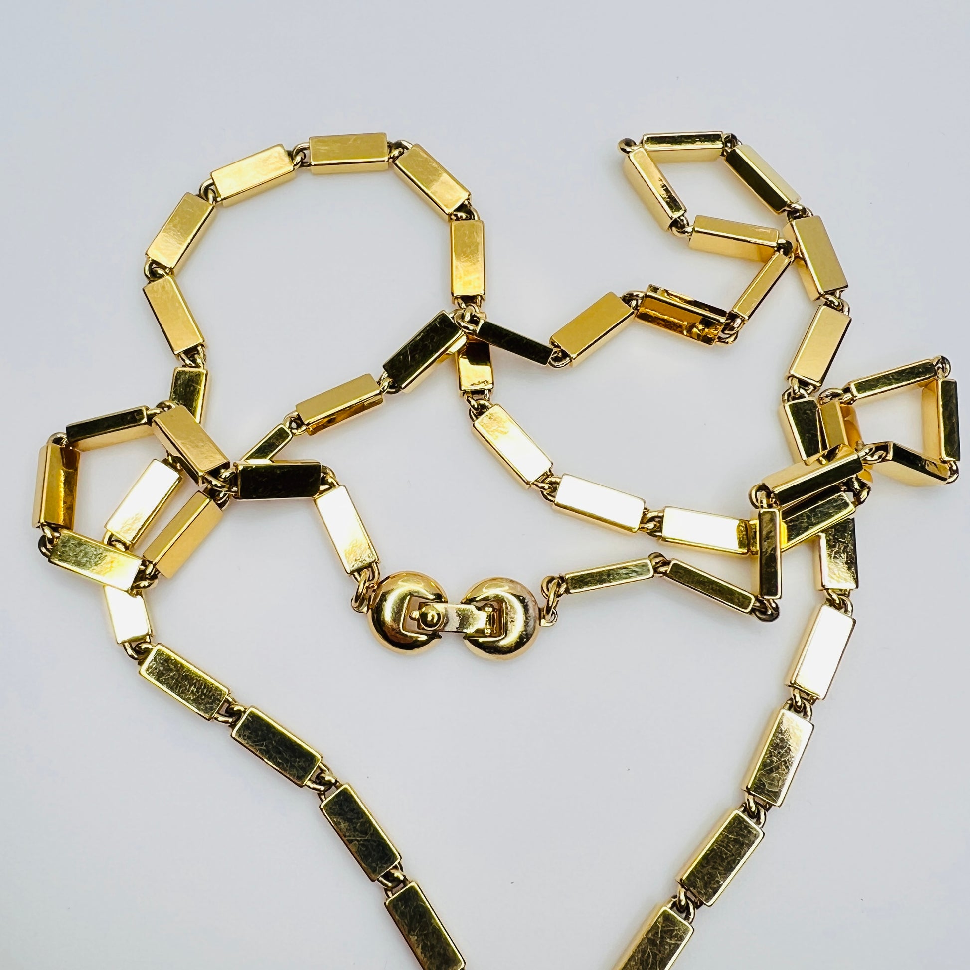 1980s Monet signed goldtone necklace with geometric pendant and rectangular chain