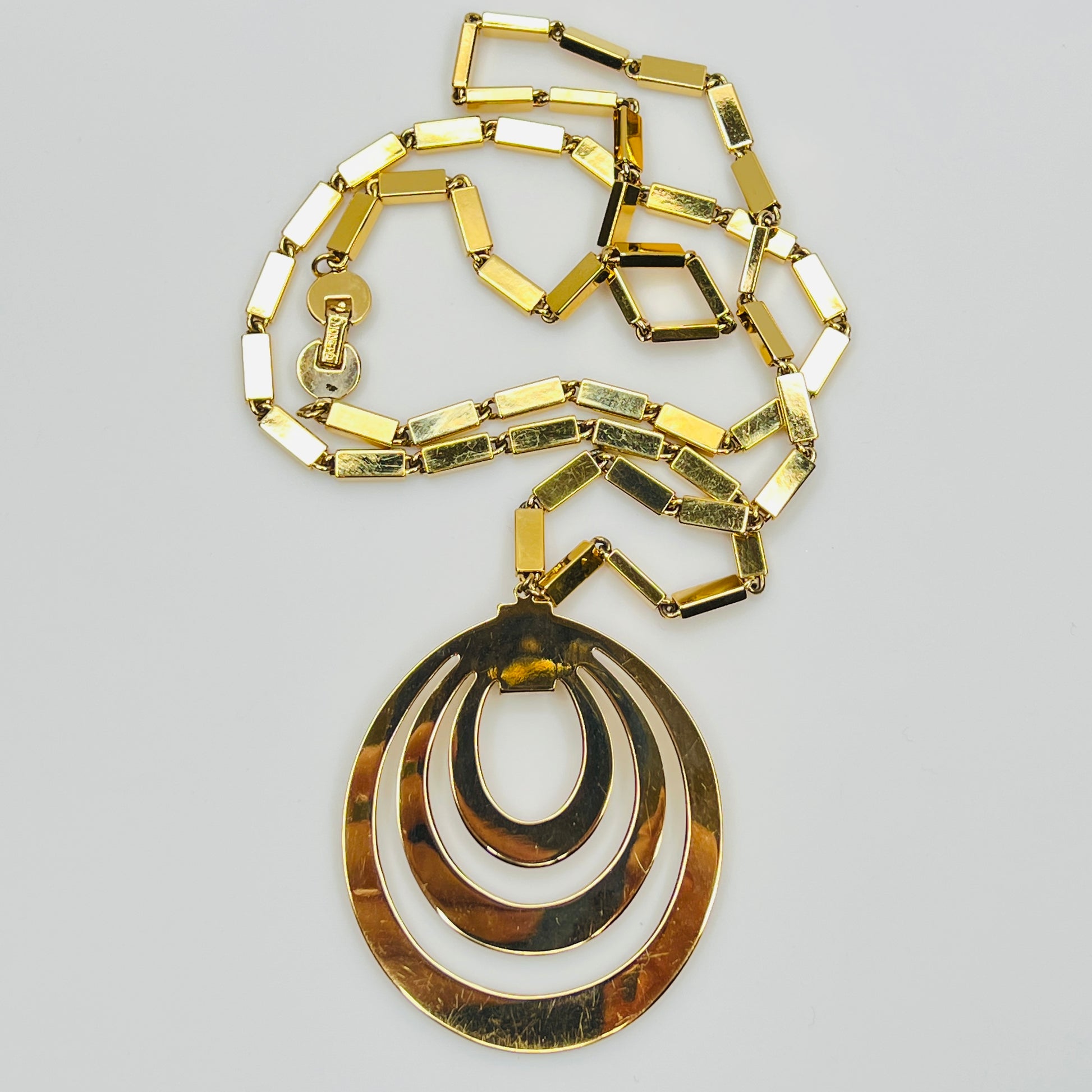 1980s Monet signed goldtone necklace with geometric pendant and rectangular chain