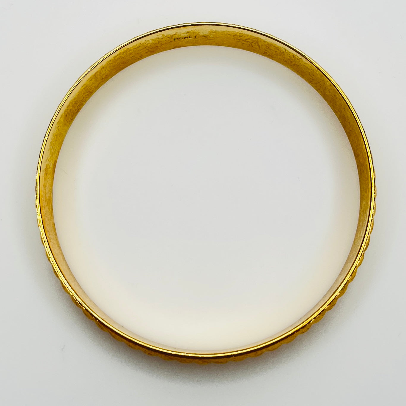 Signed Monet gold tone etched bangle bracelet