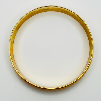 Signed Monet gold tone etched bangle bracelet