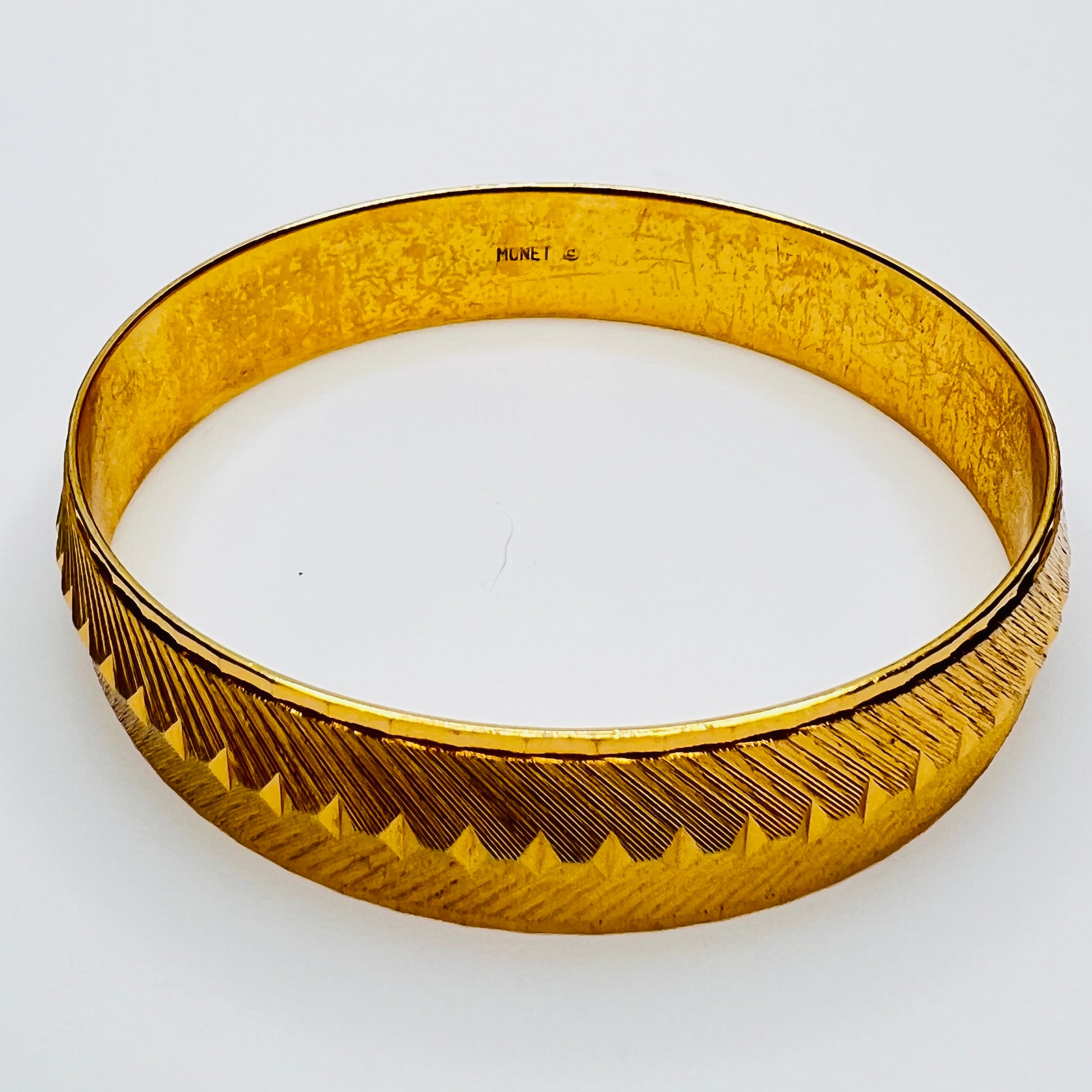 Inside view showing Monet signature on bangle
