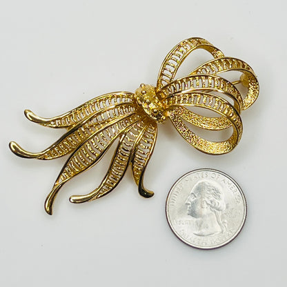 Vintage Monet goldtone ribbon brooch with sculptural bow design