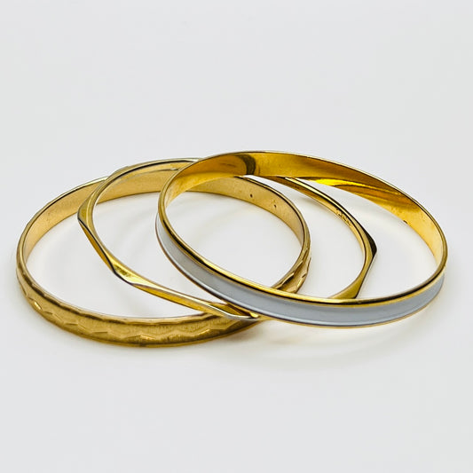 Monet and Napier gold tone bangle set with white enamel