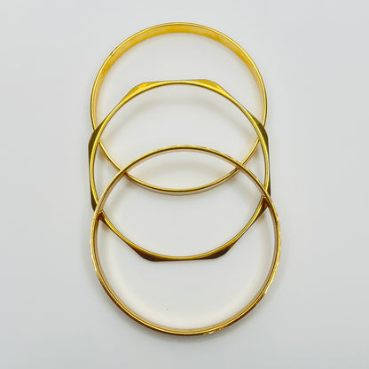 Monet and Napier gold tone bangle set with white enamel