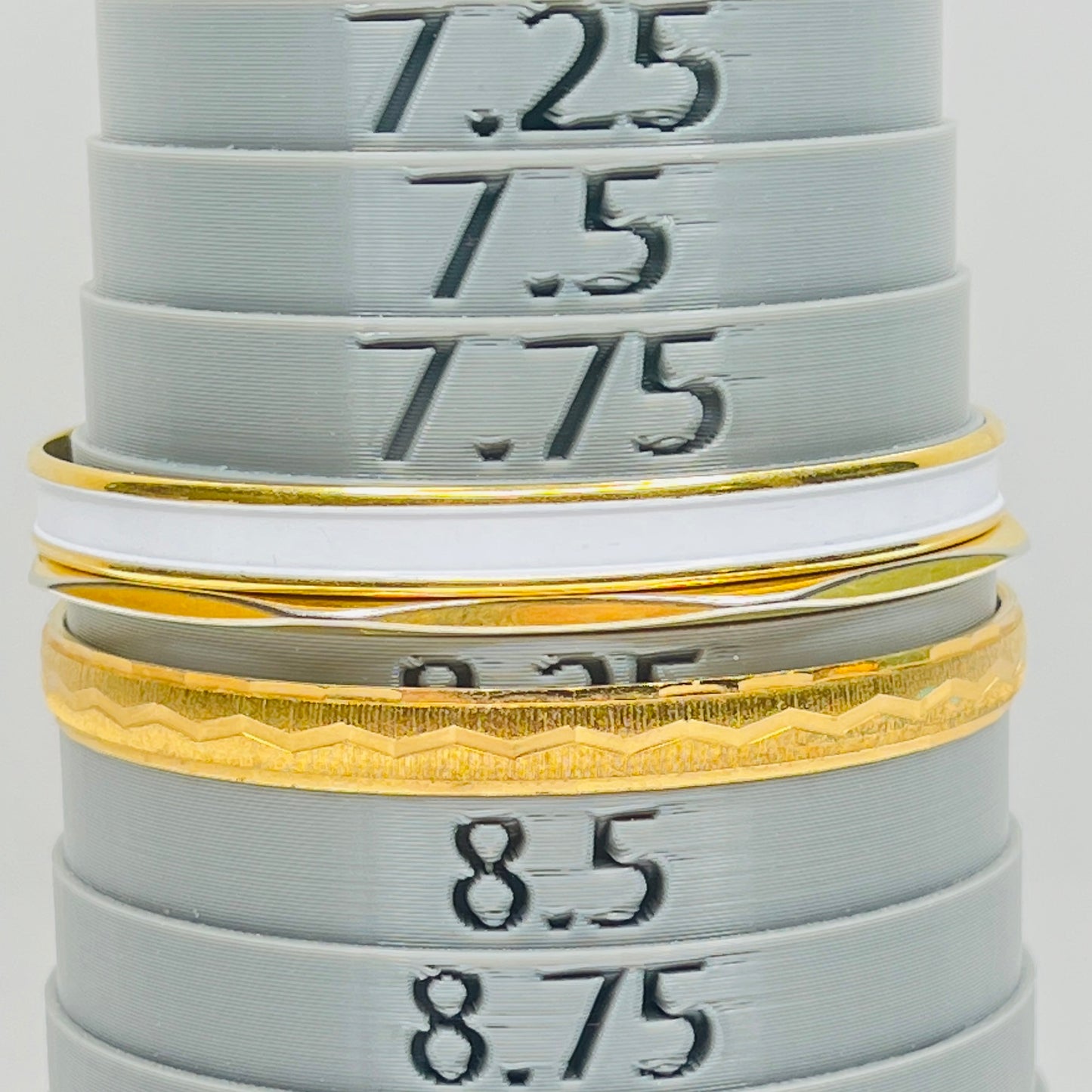 Monet and Napier gold tone bangle set with white enamel
