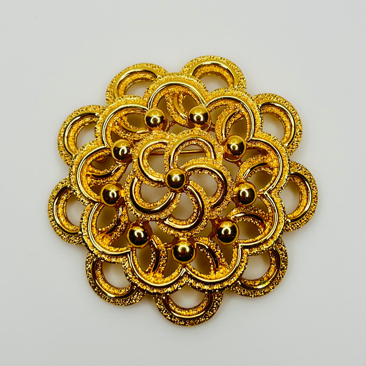 Large Monet gold tone mid century flower brooch