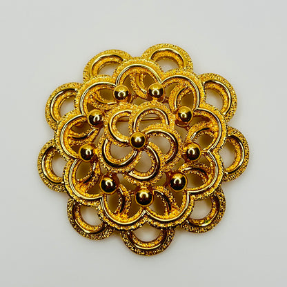 Large Monet gold tone mid century flower brooch
