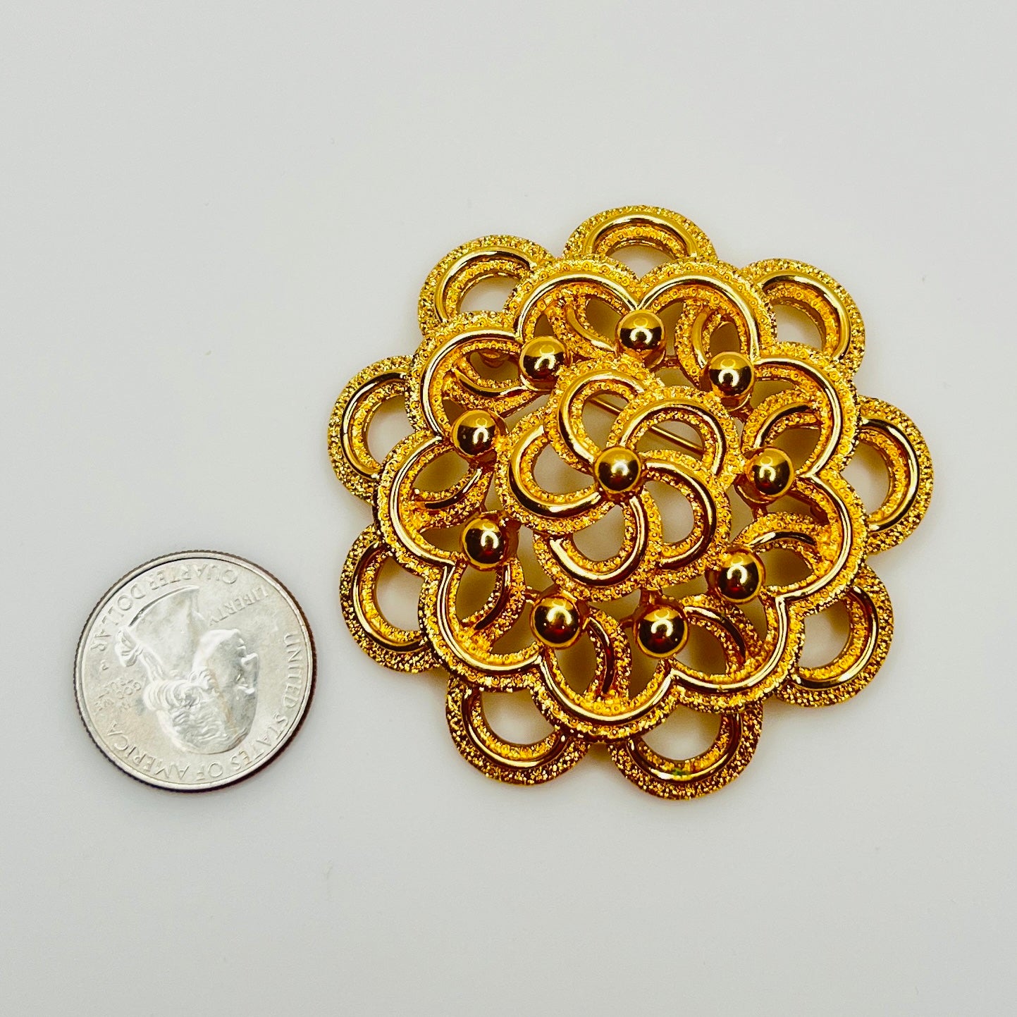 Large Monet gold tone mid century flower brooch