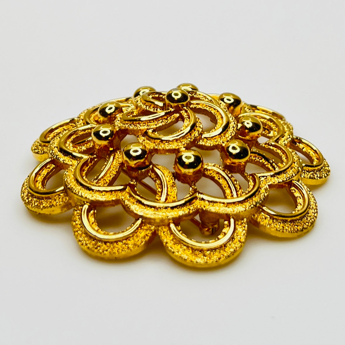 Dimensional gold floral Monet brooch 2.5 inches