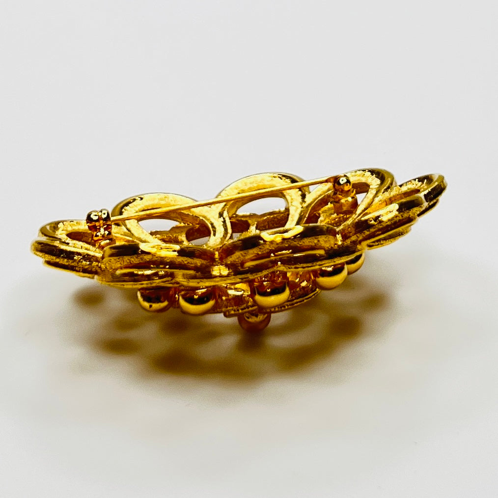 Dimensional gold floral Monet brooch 2.5 inches