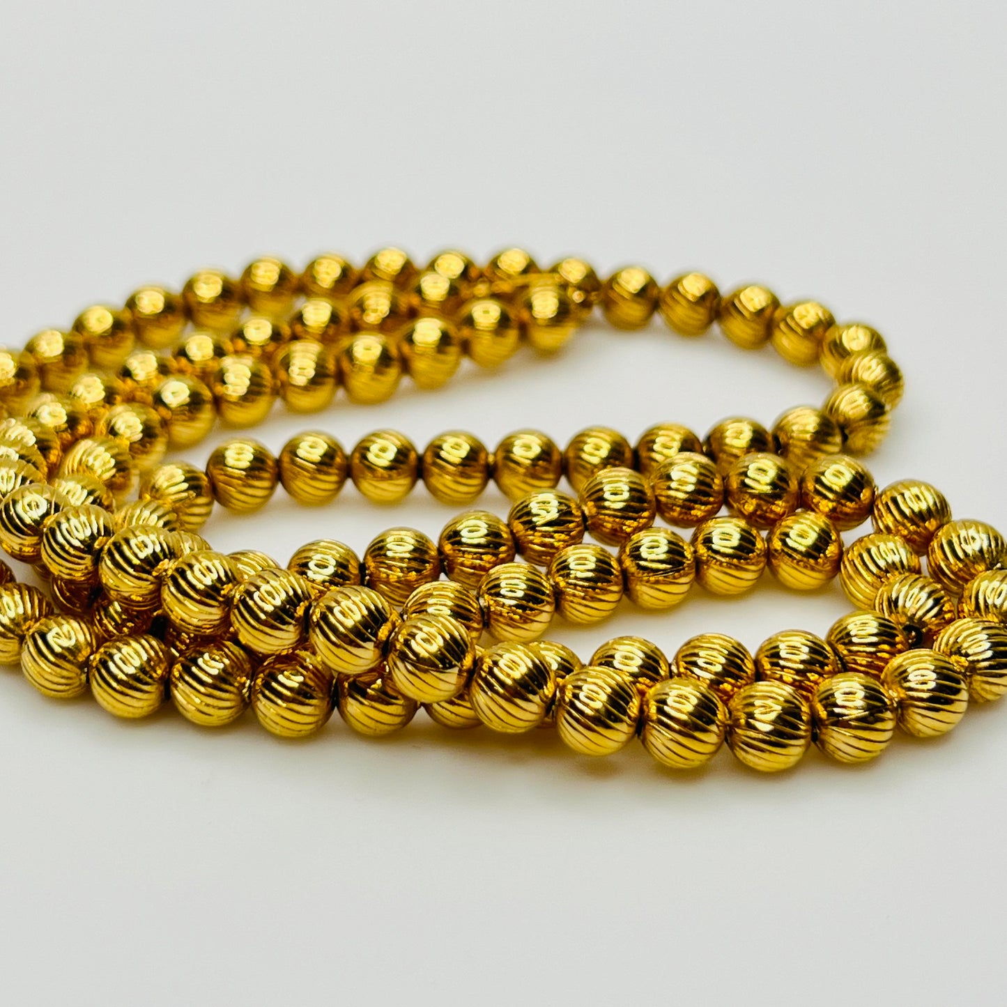 Close up textured ribbed gold beads vintage Monet necklace