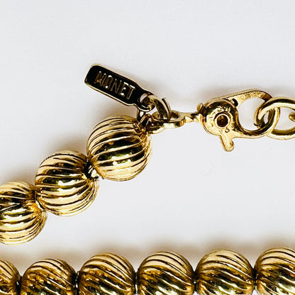 Monet vintage gold bead necklace textured 1970s long strand hang tag and clasp
