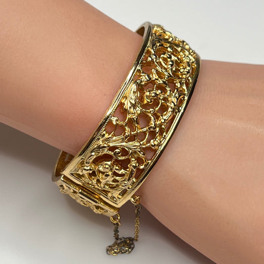 Close-up of ornate floral openwork design on vintage Napier bracelet
