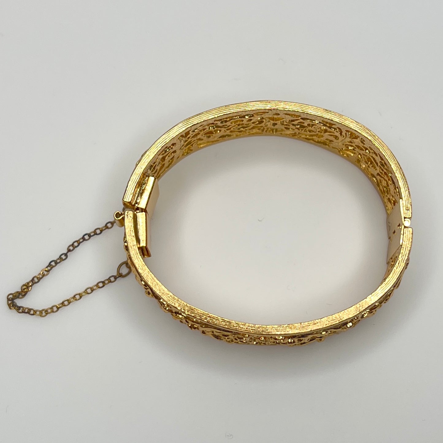 Vintage Napier gold filigree hinged bangle bracelet with safety chain