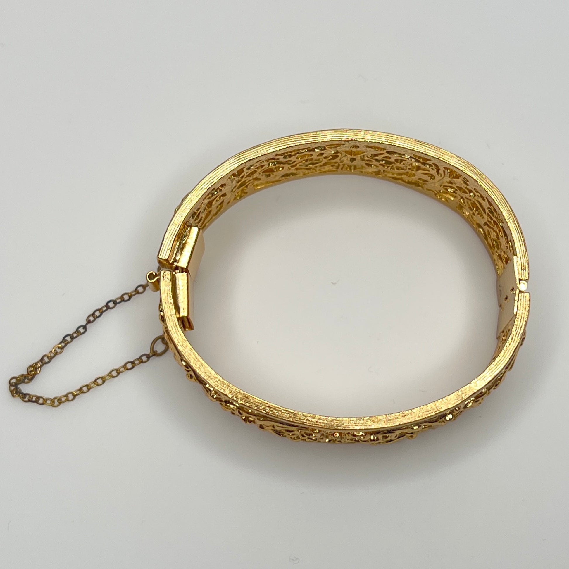 Vintage Napier gold filigree hinged bangle bracelet with safety chain
