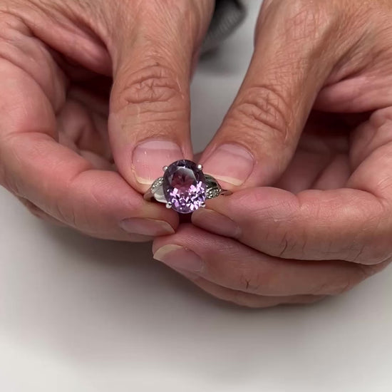 Vintage sterling silver ring with oval purple amethyst and diamond accents