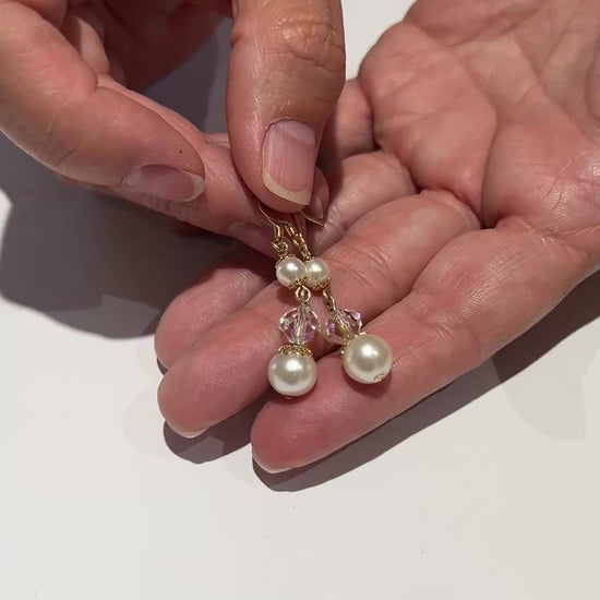 Gold-tone dangle earrings with faux pearls and faceted aurora borealis crystals, vintage 1960s