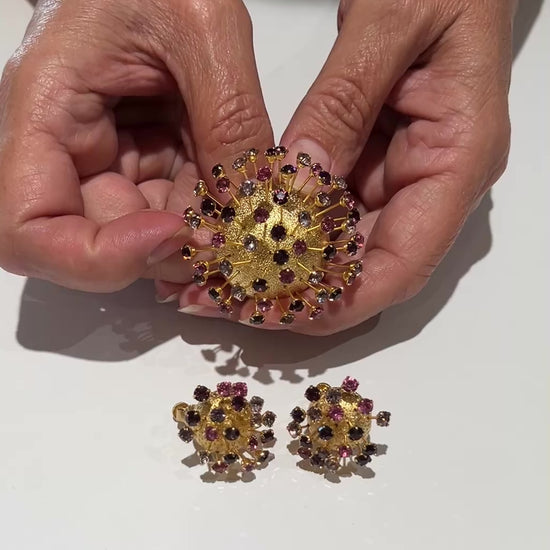 Corocraft goldtone Sputnik brooch with pink and purple rhinestones, mid-century style