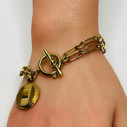 Oversized toggle clasp on designer Ralph Lauren gold-tone bracelet