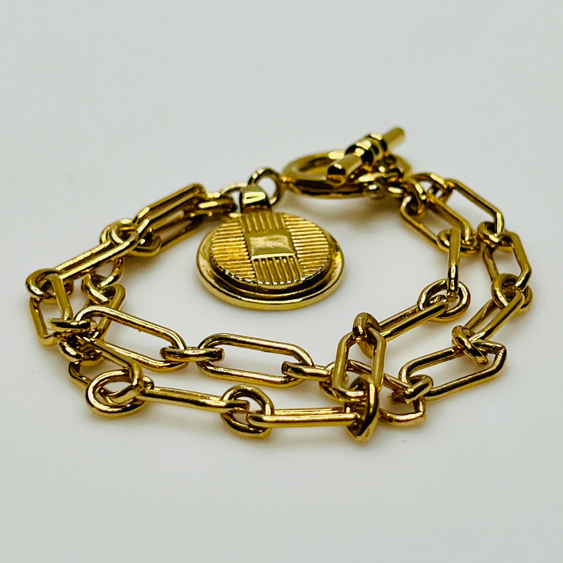 Gold-plated Ralph Lauren charm bracelet with double chain and toggle clasp
