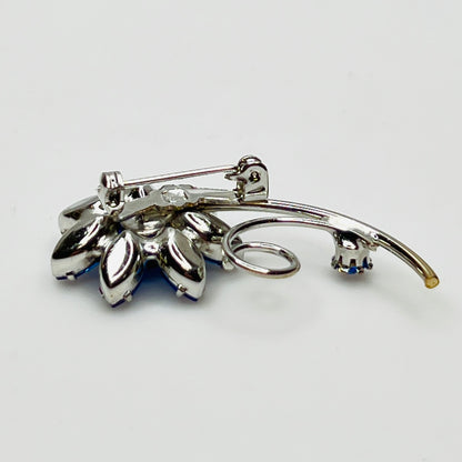 Reverse of brooch with polished silver-tone back and pin clasp