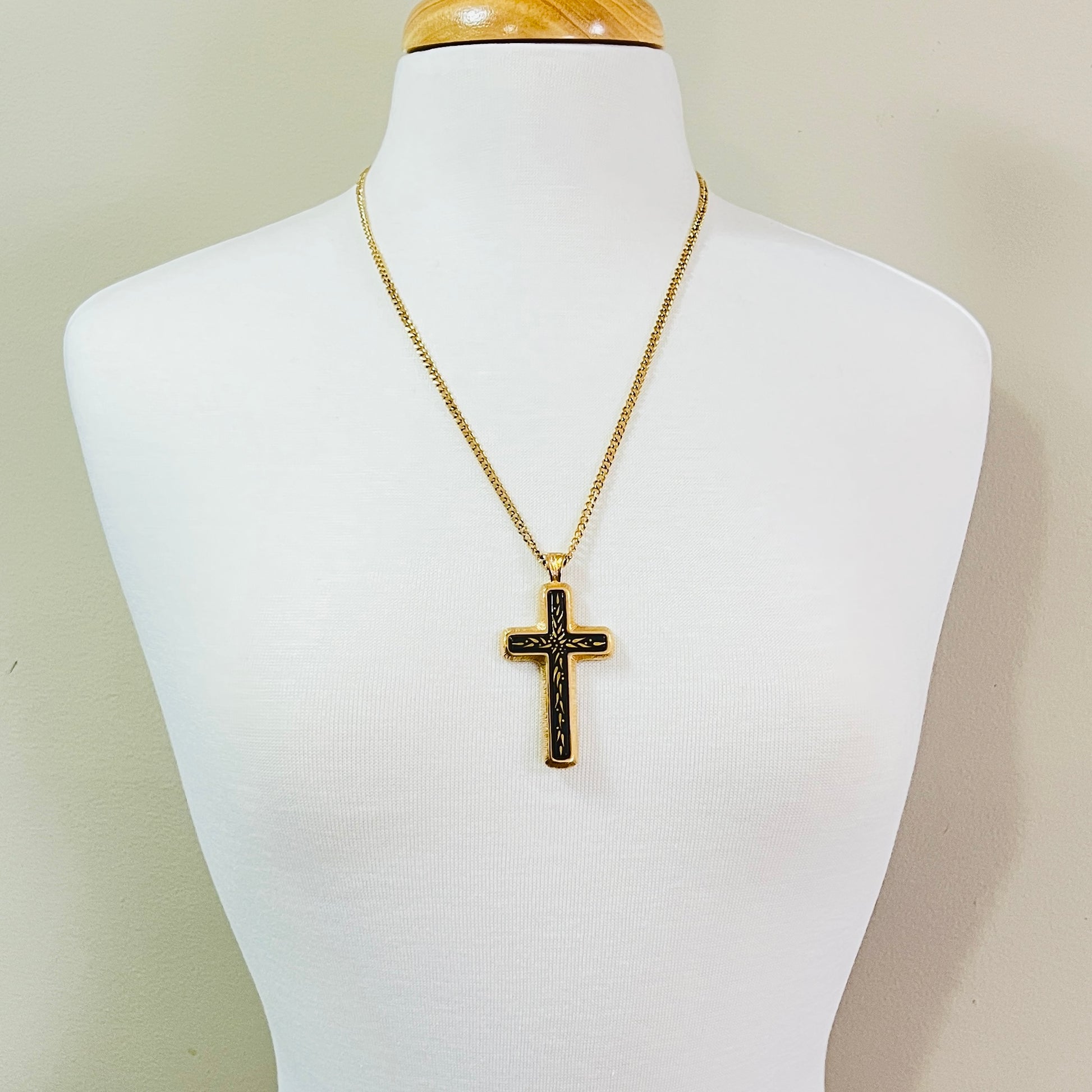 Vintage Sarah Coventry cross necklace shown on mannequin bust