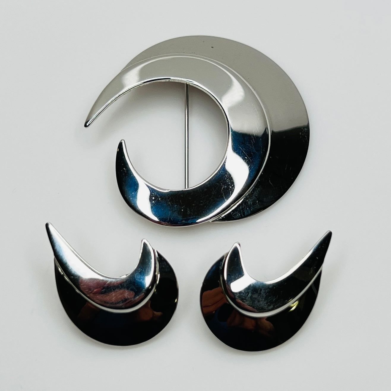 Vintage silver-tone crescent moon brooch and earrings set by Sarah Coventry