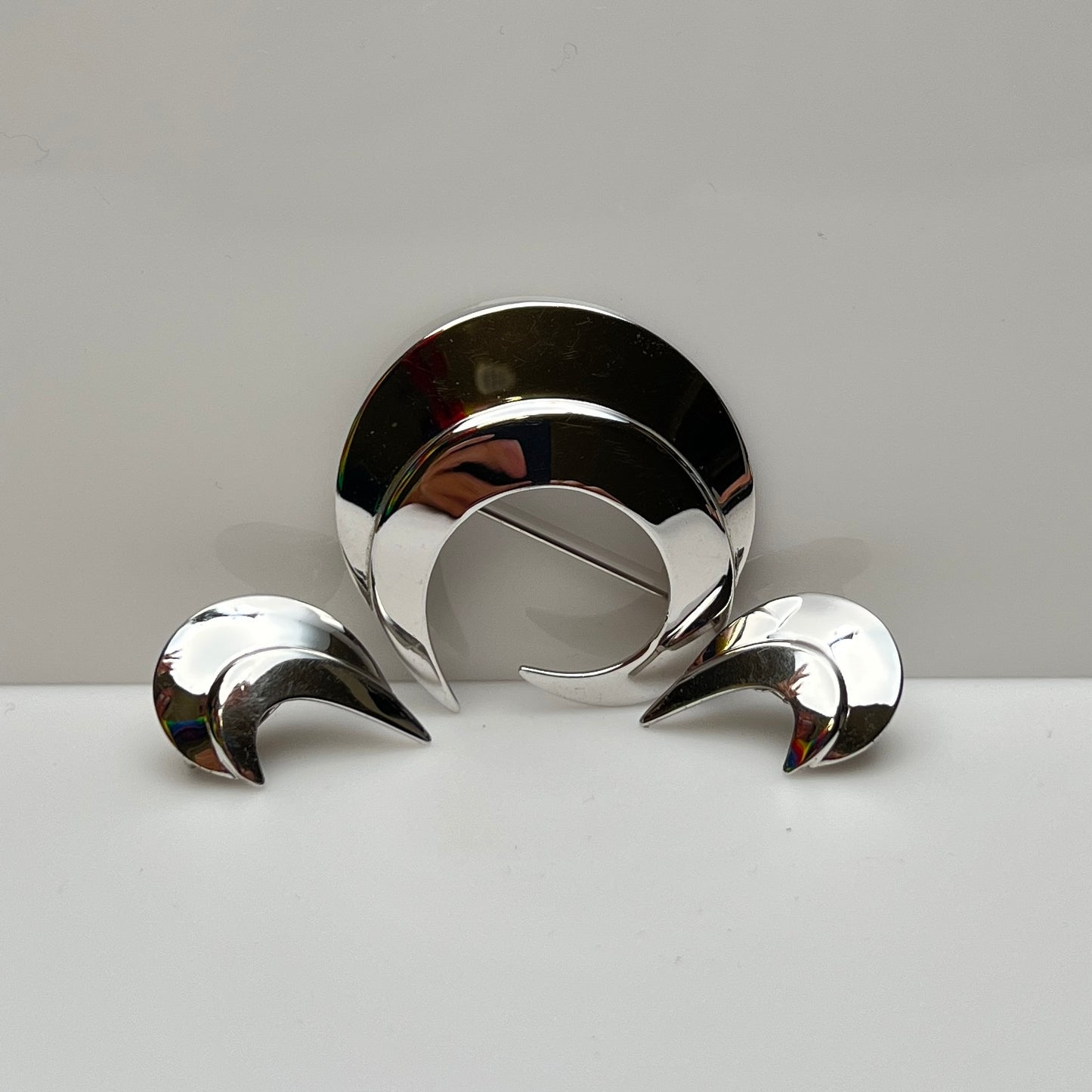 Vintage silver-tone crescent moon brooch and earrings set by Sarah Coventry