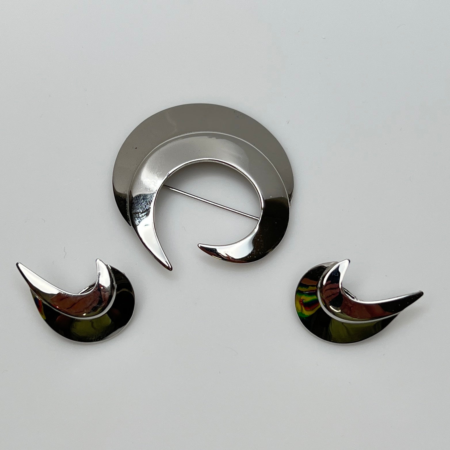 Vintage silver-tone crescent moon brooch and earrings set by Sarah Coventry