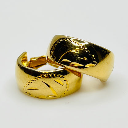 Sarah Coventry gold-tone etched hoop earrings with leaf design