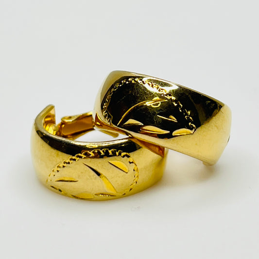 Sarah Coventry gold-tone etched hoop earrings with leaf design