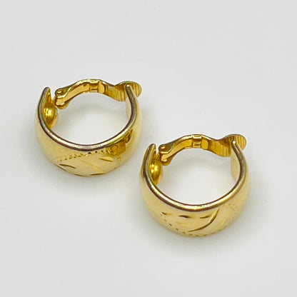 Sarah Coventry gold-tone etched hoop earrings with leaf design