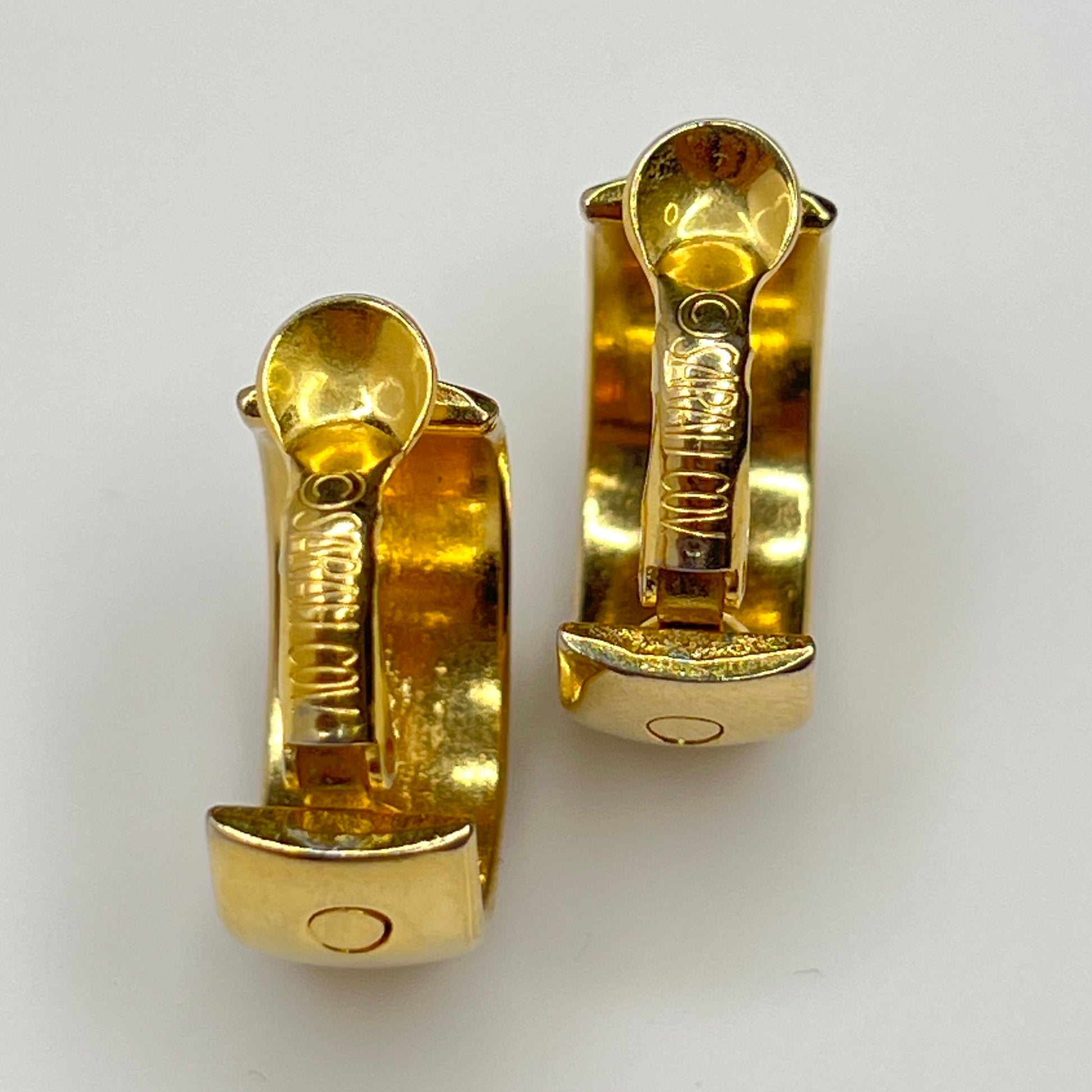 Close-up of Sarah Coventry signature on clips