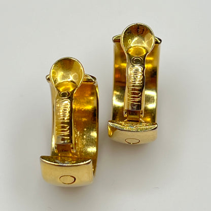 Close-up of Sarah Coventry signature on clips