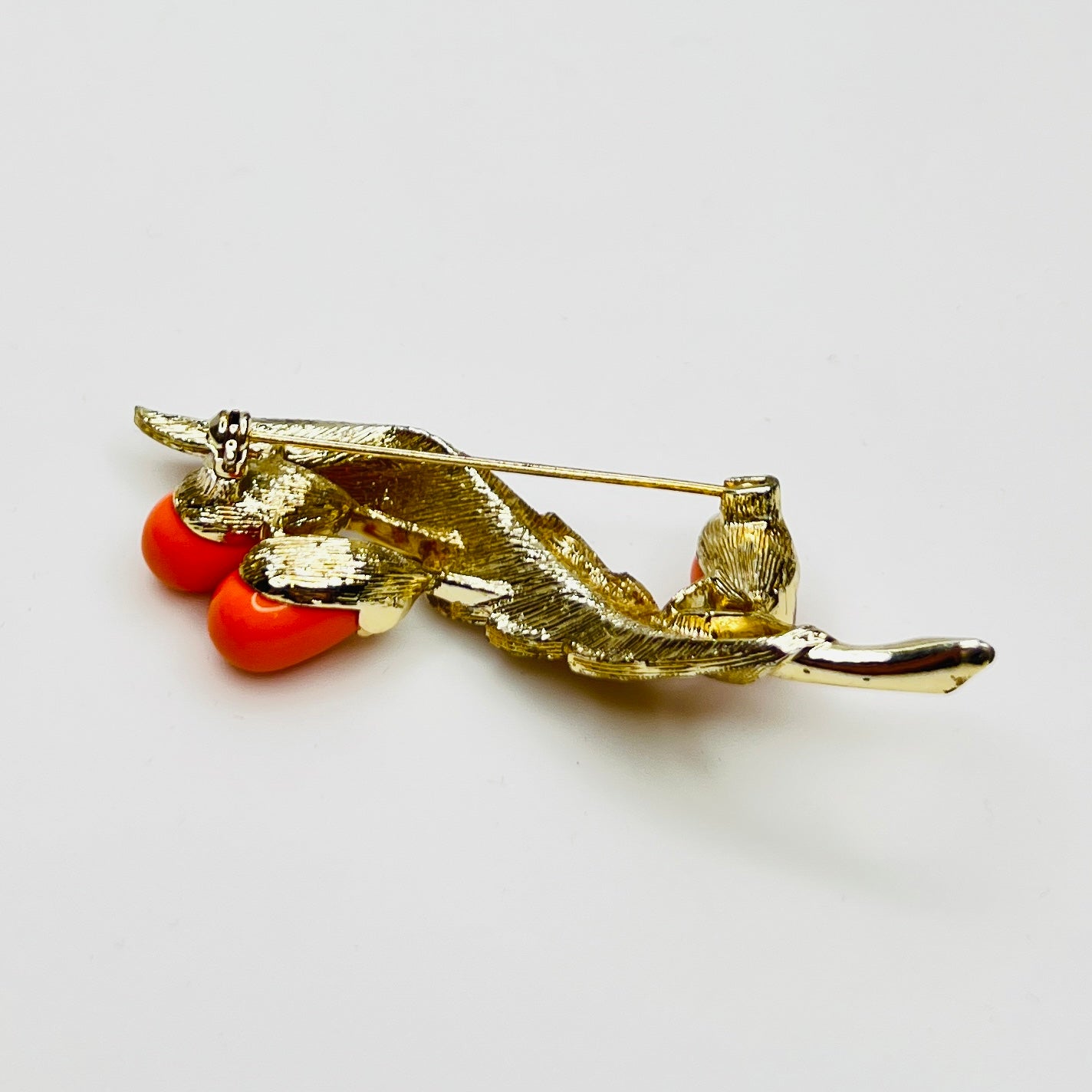 Reverse of brooch with Sarah Coventry signature on gold-tone metal