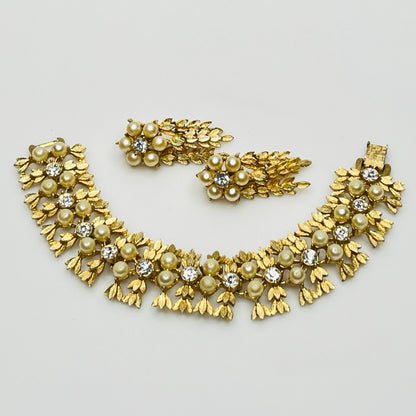 Vintage Sarah Coventry gold-tone bracelet and clip-on earrings with faux pearls and rhinestones.