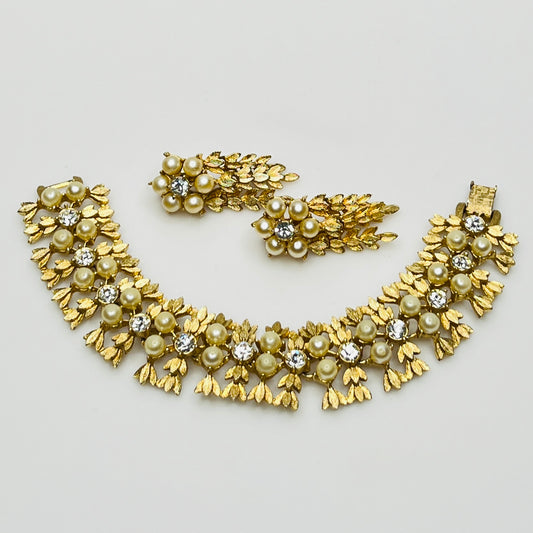 Vintage Sarah Coventry gold-tone bracelet and clip-on earrings with faux pearls and rhinestones.