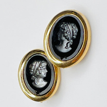 Sarah Coventry oval clip-on earrings with hematite intaglio profiles – front view