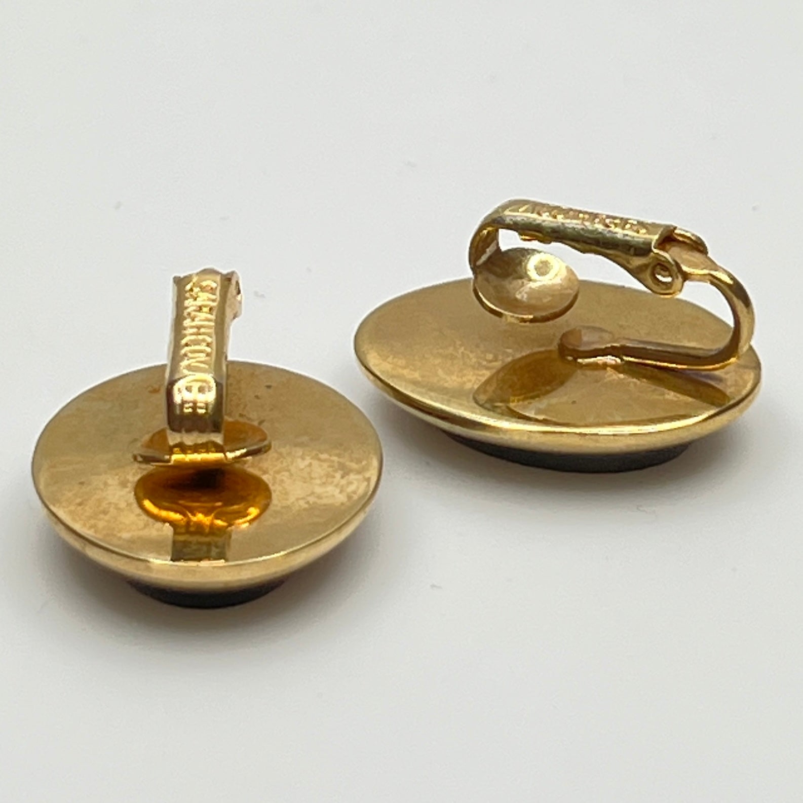 Reverse of earrings signed Sarah Coventry on clip backs