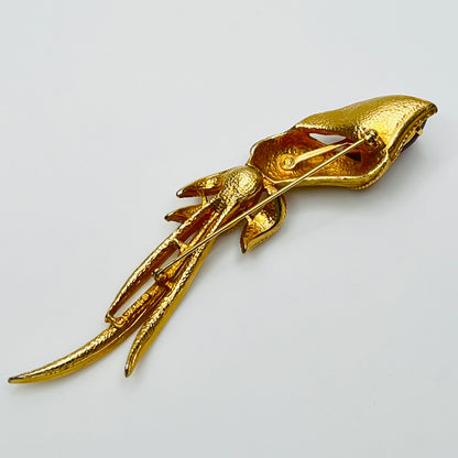 Gold-tone calla lily brooch with amber rhinestone and clear accents, signed Sarah Coventry