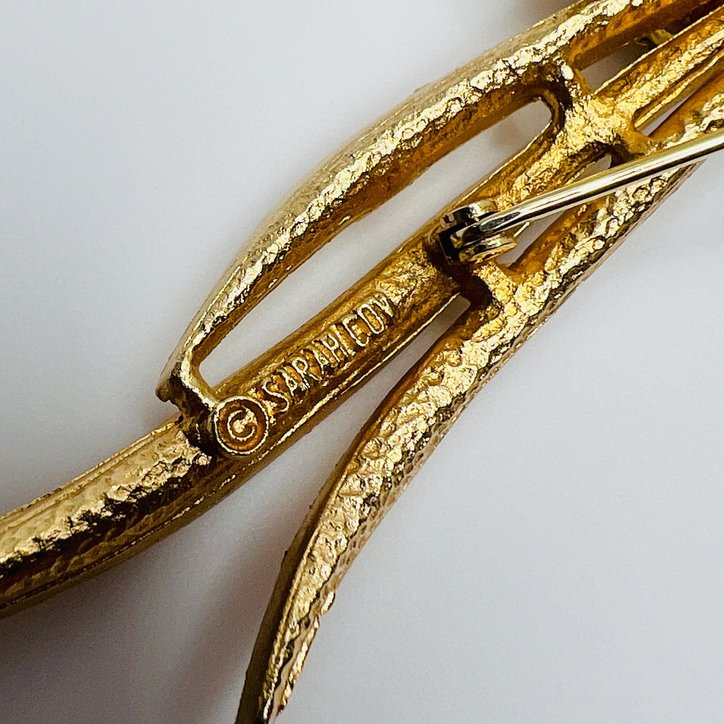 Gold-tone calla lily brooch with amber rhinestone and clear accents, signed Sarah Coventry