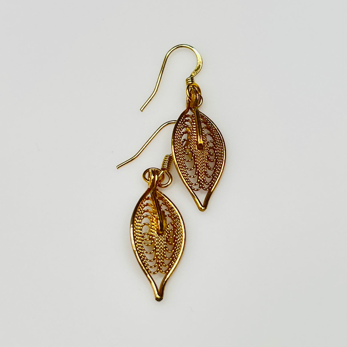 Upcycled vintage earrings with delicate leaf design and gold ear wires