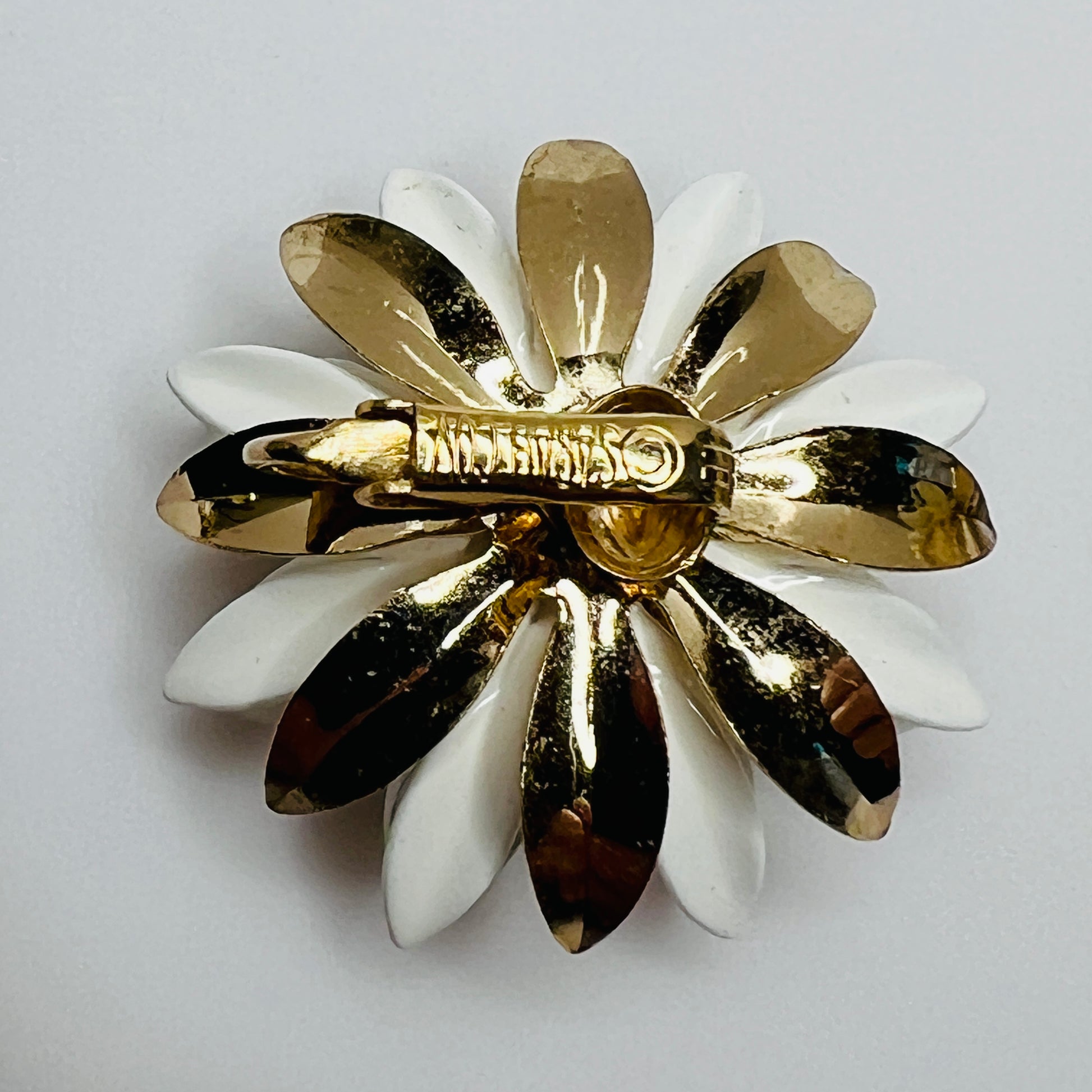 1960s clip-on earrings with matching enamel floral design