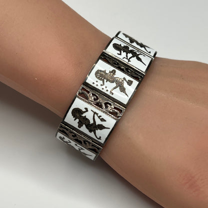 Siam Sterling bracelet on wrist, nine panel design with mythological figures
