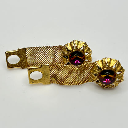Close-up of round prismatic rivoli cufflink in gold-tone sunburst bezel