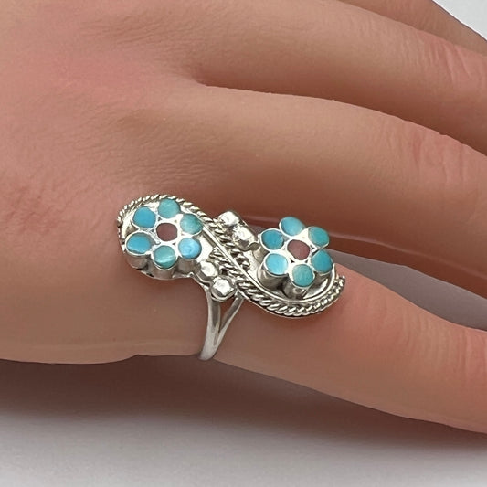 Sterling silver turquoise flower ring on hand, pinky fit with double floral design